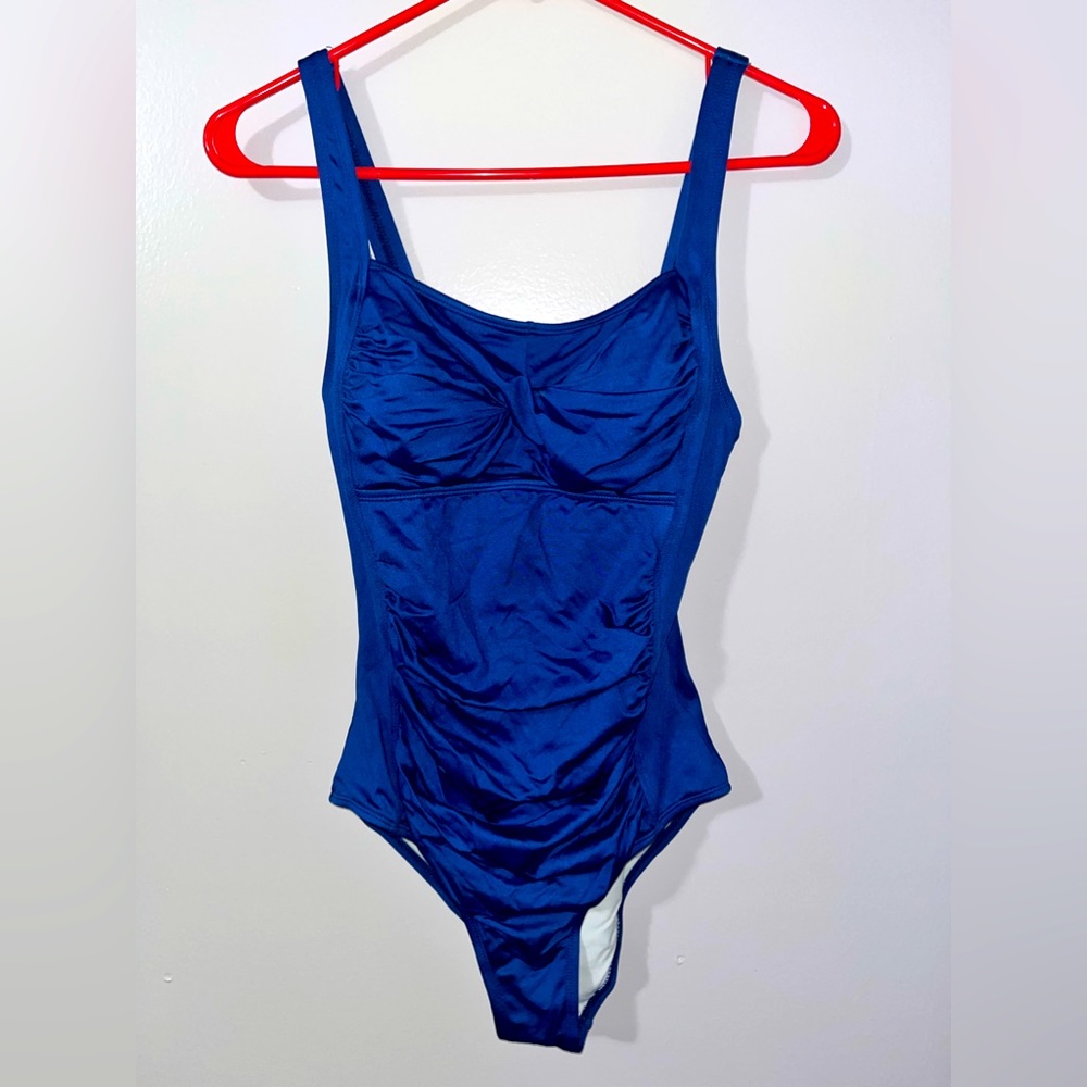 Full coverage one piece with belly ruching.